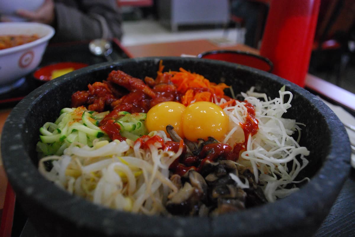 Korean cuisine-BBQ Chicken Dolsot Bibimbap — Bibimbap means mixed rice — and that is the whole point