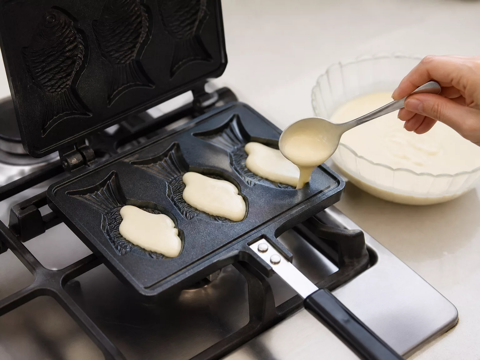 Step 2: Fill each fish 1/3 to 70% with batter.