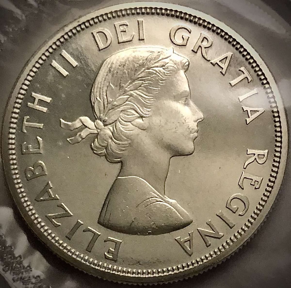 Rewers Kanadyjskiej monety 1 dolarowej z 1964- Reverse of 1 Canadian Dollar from 1964 — CAD to KRW Today: 1 CAD = 958 KRW, a 2-Month Low