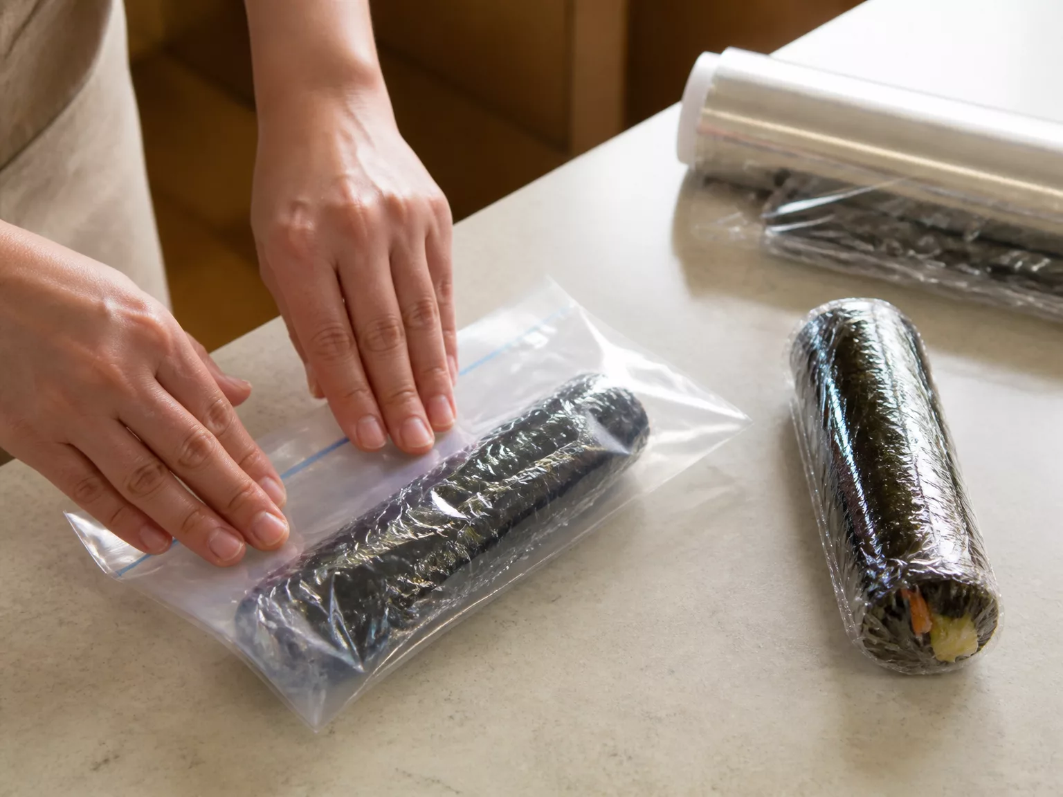 Step 3: Double wrap: plastic wrap directly on the roll, then a zipper bag…