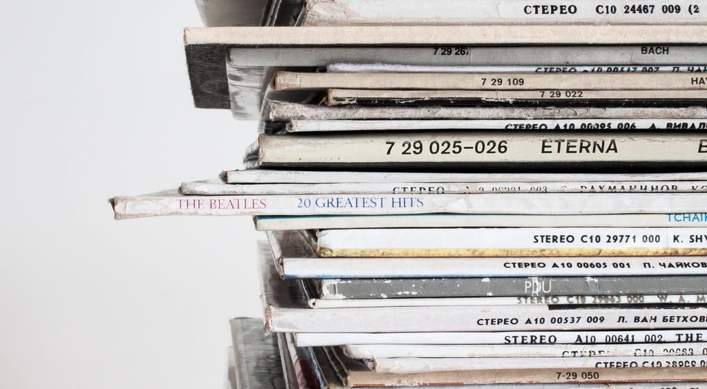 close-up stack old vinyl records — How many copies for each Circle certification tier
