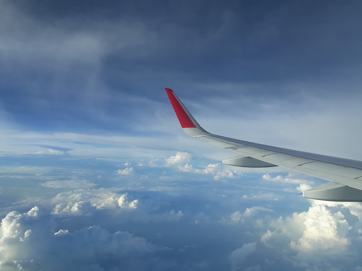 Aerial photograph of clouds from flight window 02 — Jeju travel in 2026: why autumn beats monsoon for your flight down