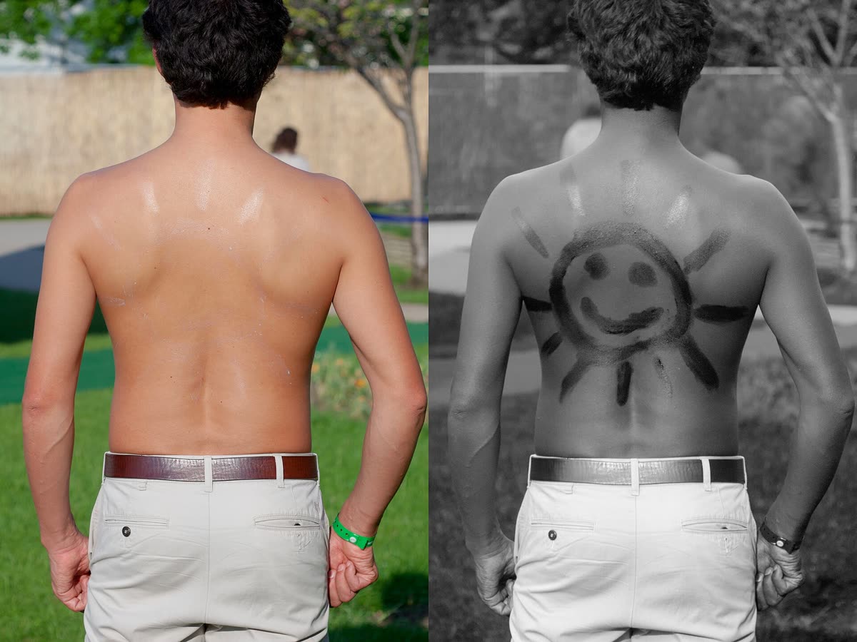 Sunscreen on back under normal and UV light — No white cast: mineral vs chemical filters