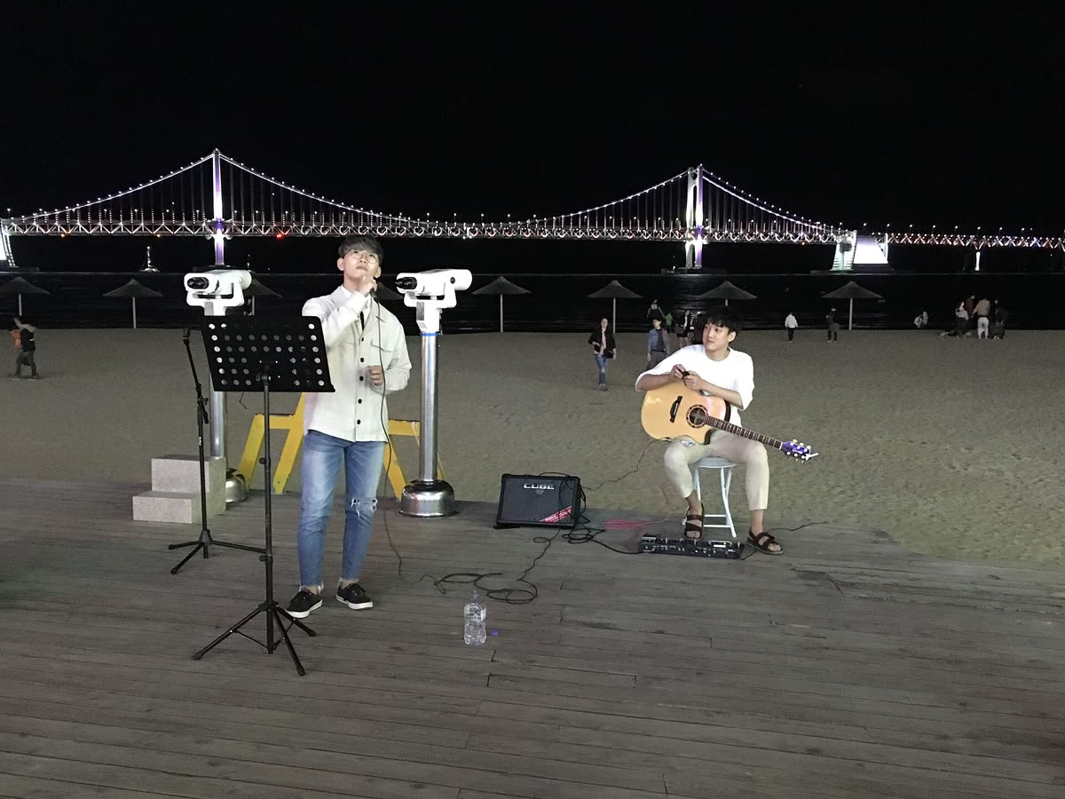 Singer and guitarist at Gwangalli Beach — What the Alleys Look Like