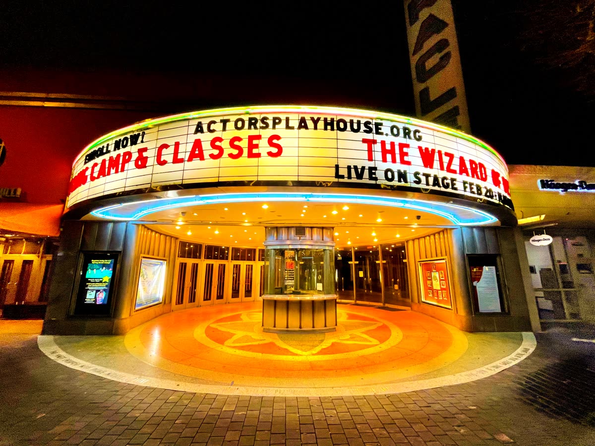 Miracle Theater, Coral Gables Florida - Night view with illuminated marquee, Feb 2021 — Reawaken Man The Red release date and theaters