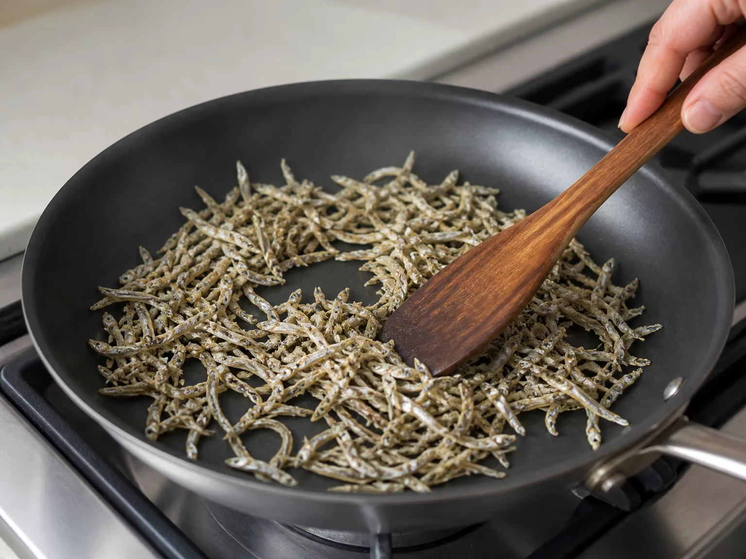 Step 3: Dry-toast the anchovies about 1-2 minutes, stirring