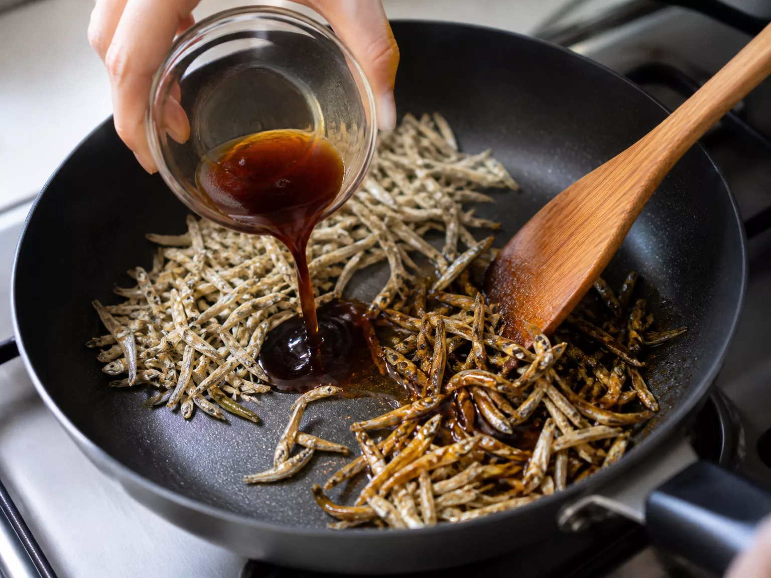 Step 5: Push the anchovies aside, pour in the glaze, and toss everything…